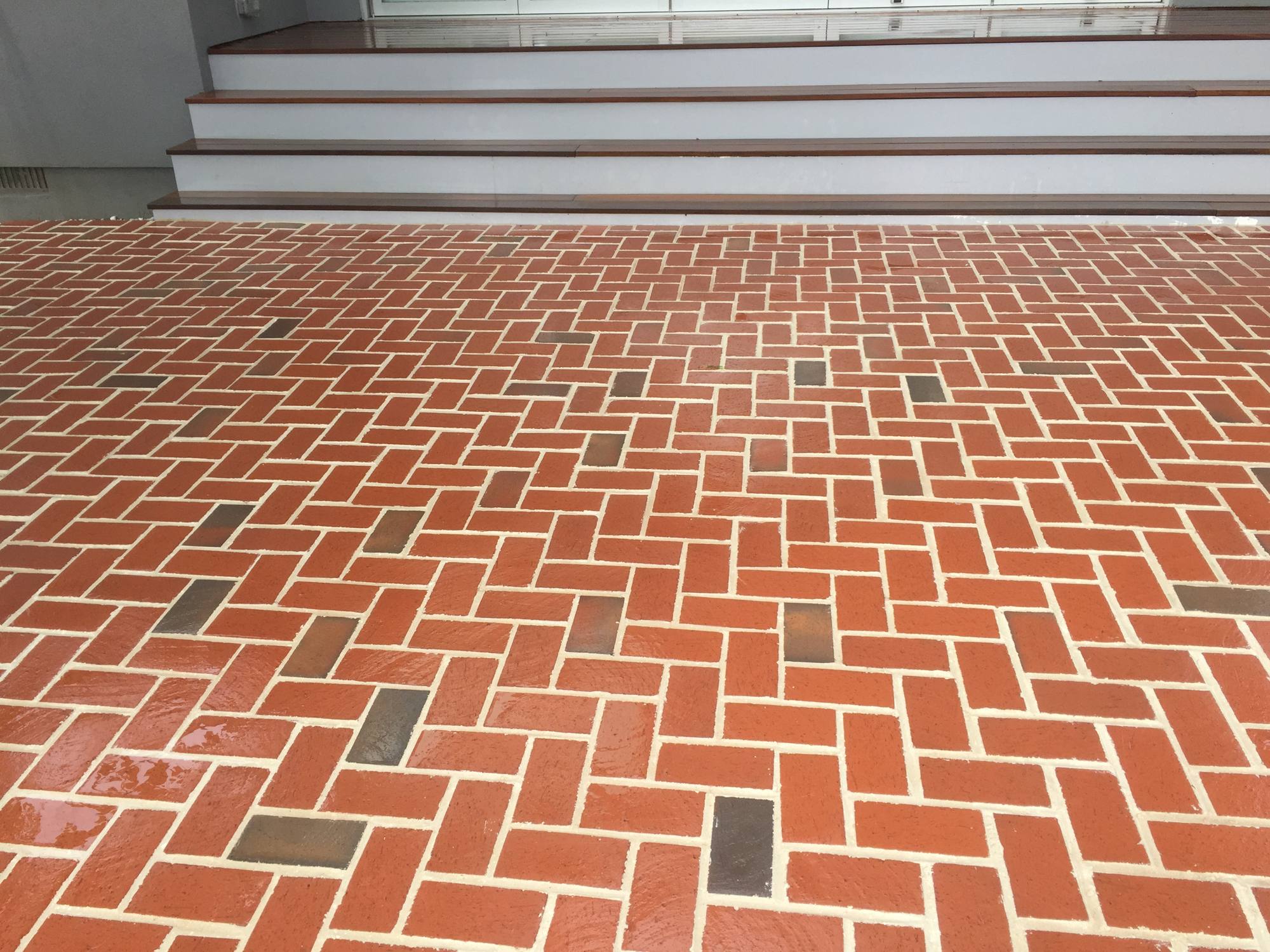 Red clay brick driveway apron in herringbone pattern in Northern Virginia