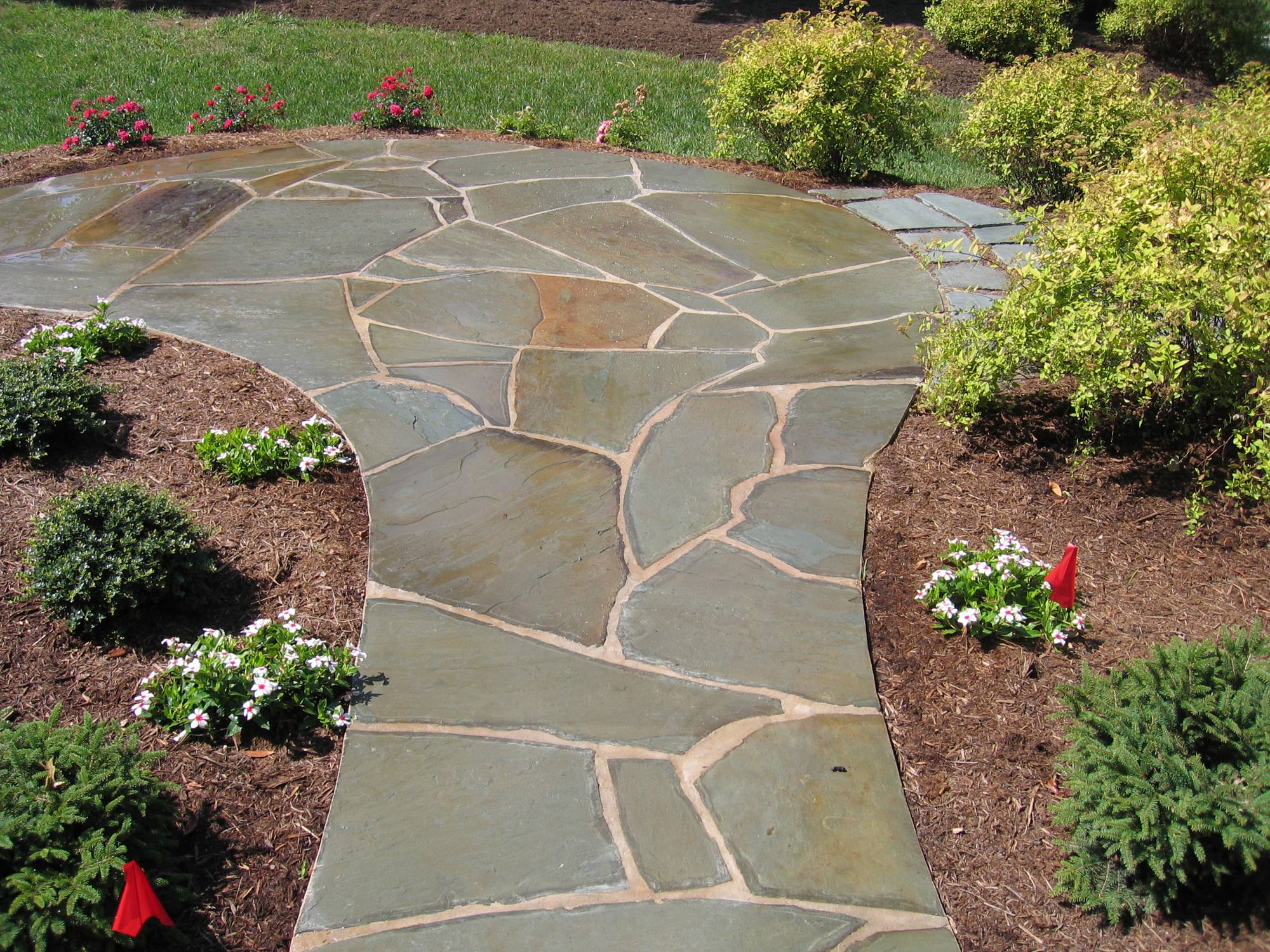 Curved flagstone walkway through flower beds in Northern Virginia